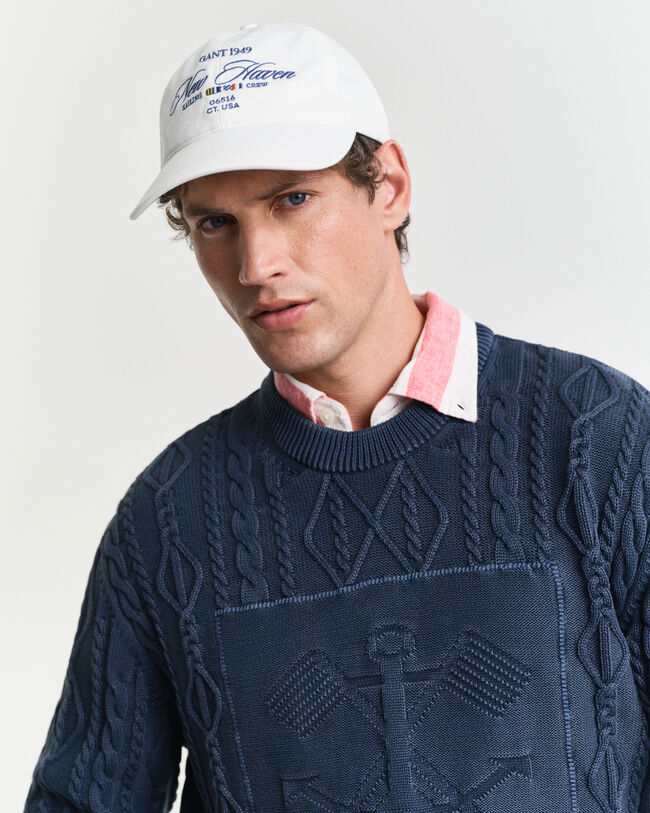 Palmikkoneule, jossa py&ouml;re&auml; p&auml;&auml;ntie