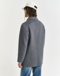 Käsin tikattu kansitakki