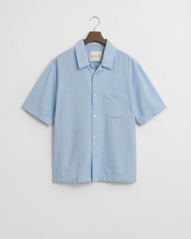 Väljästi mitoitettu lyhythihainen kohopintainen paita