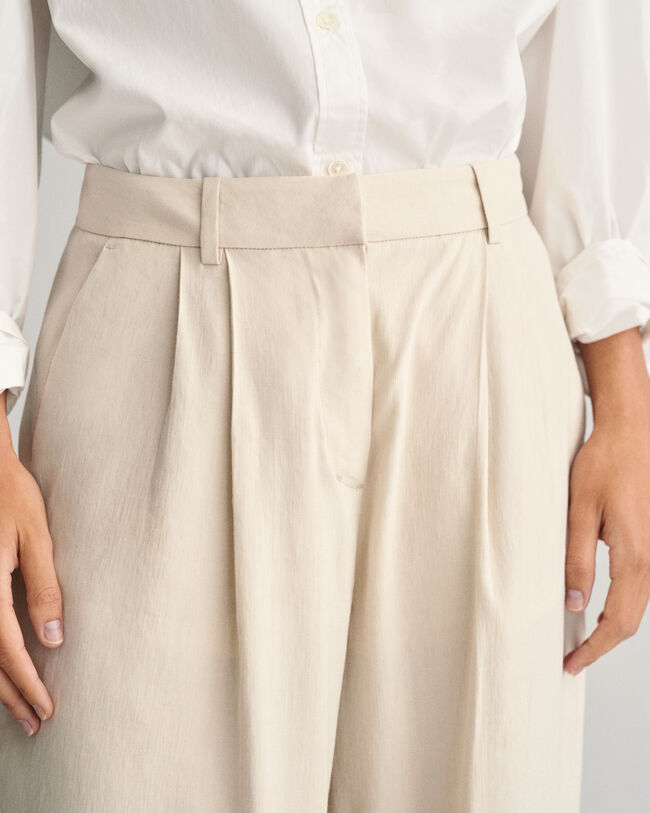 Relaxed fit ‑mitoitetut huolitellut joustopellavahousut