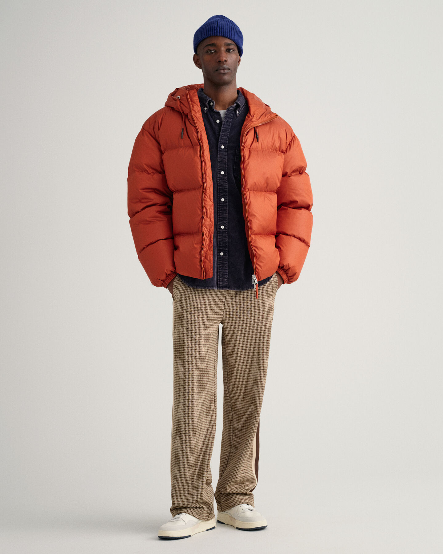 Kiiltävä toppatakki