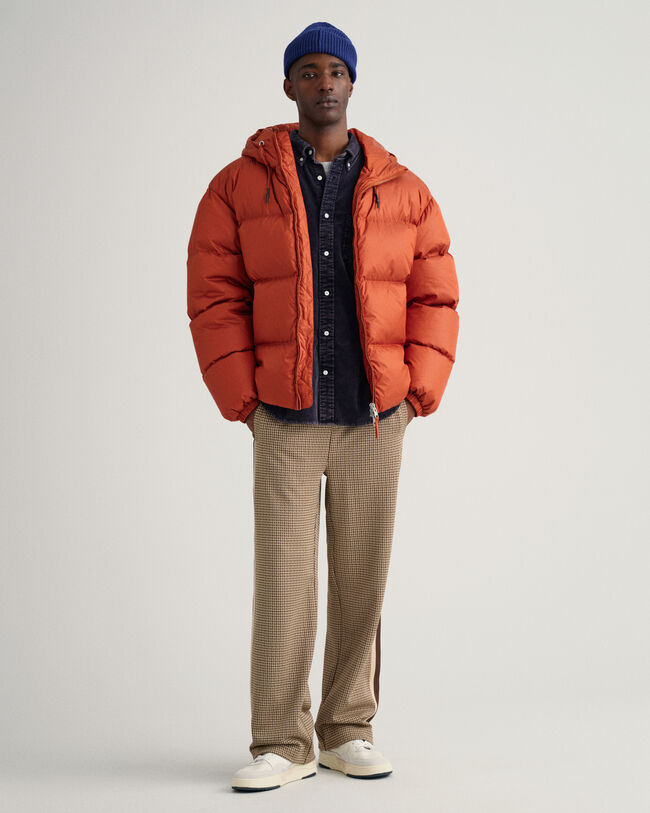 Kiiltävä toppatakki