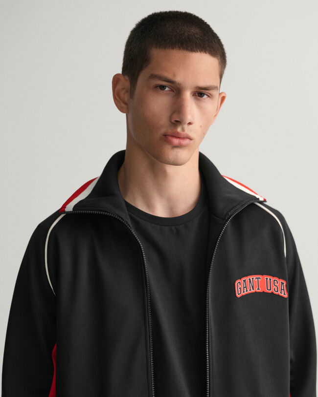 Monivärinen verryttelytakki