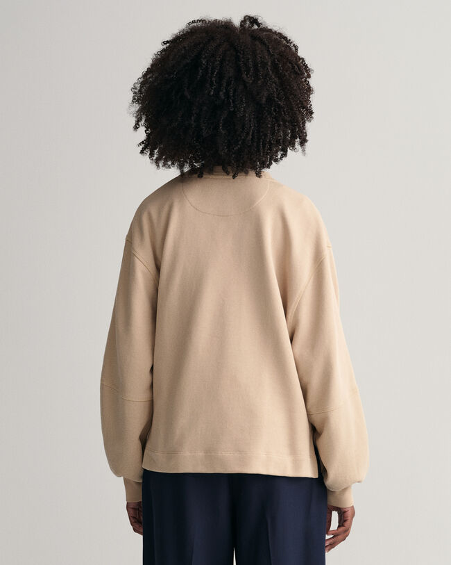 Logolla varustettu väljähihainen collegepaita