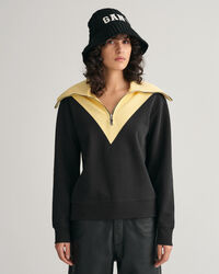 Oversized fit -mitoitettu collegepaita, jossa vetoketju p&auml;&auml;ntiell&auml; ja v&auml;ripintoja