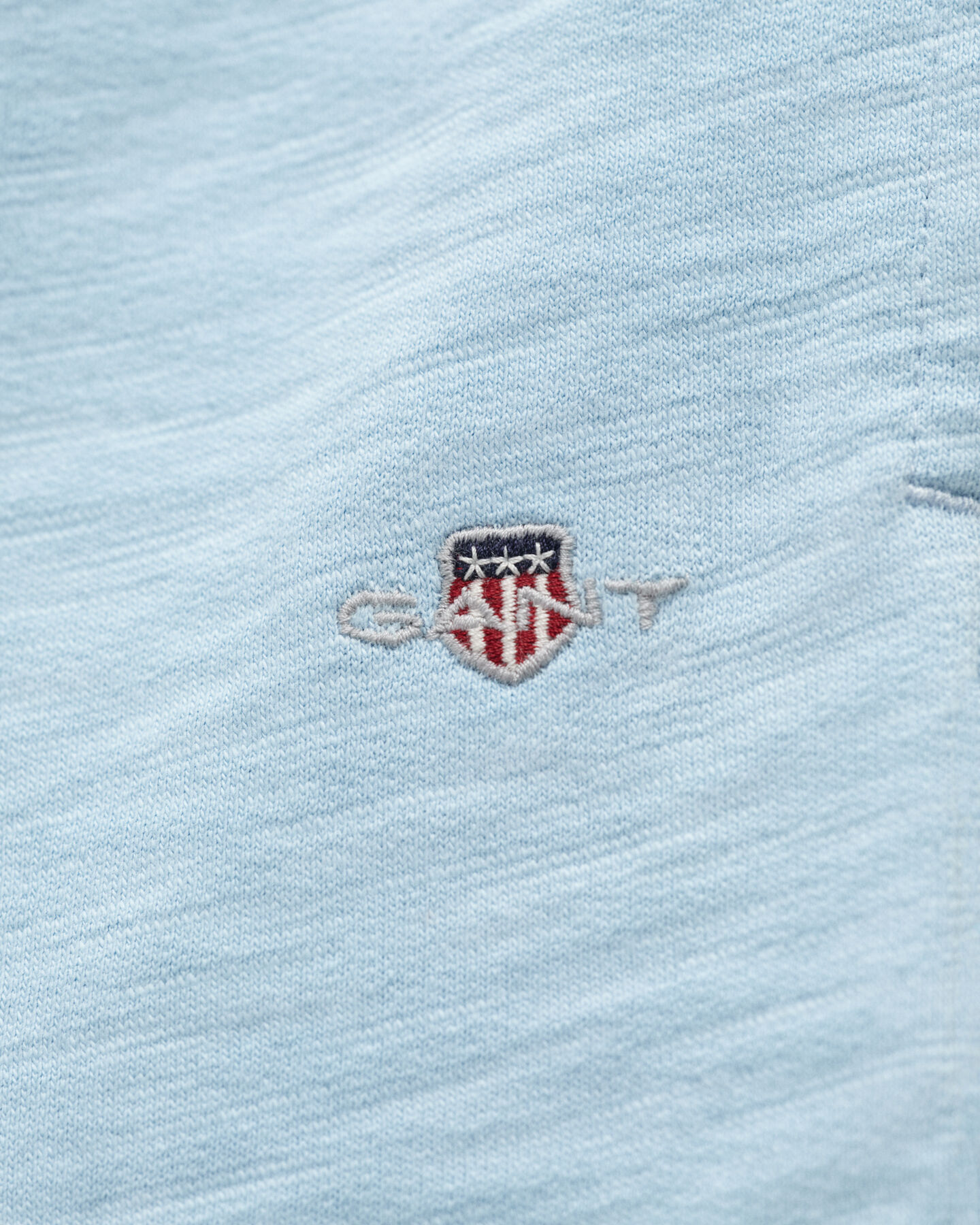 Teens-malliston slubipuuvillaiset Shield-collegeshortsit