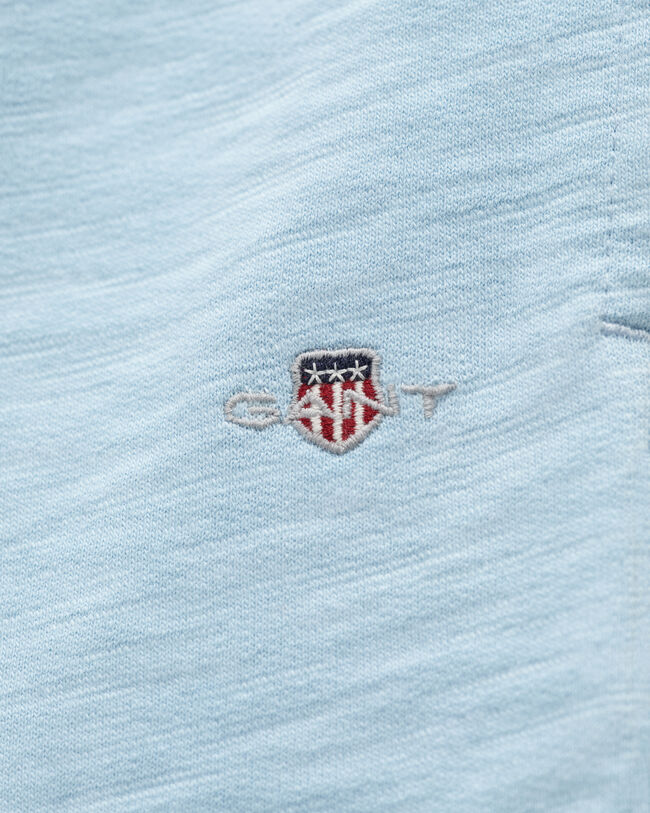 Teens-malliston slubipuuvillaiset Shield-collegeshortsit