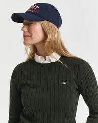 Joustopuuvillainen palmikkoneulepusero, jossa pyöreä pääntie