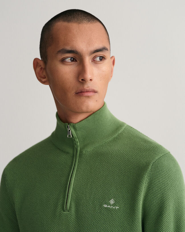 Puuvillapikeekankaasta tehty neulepusero puolivetoketjulla