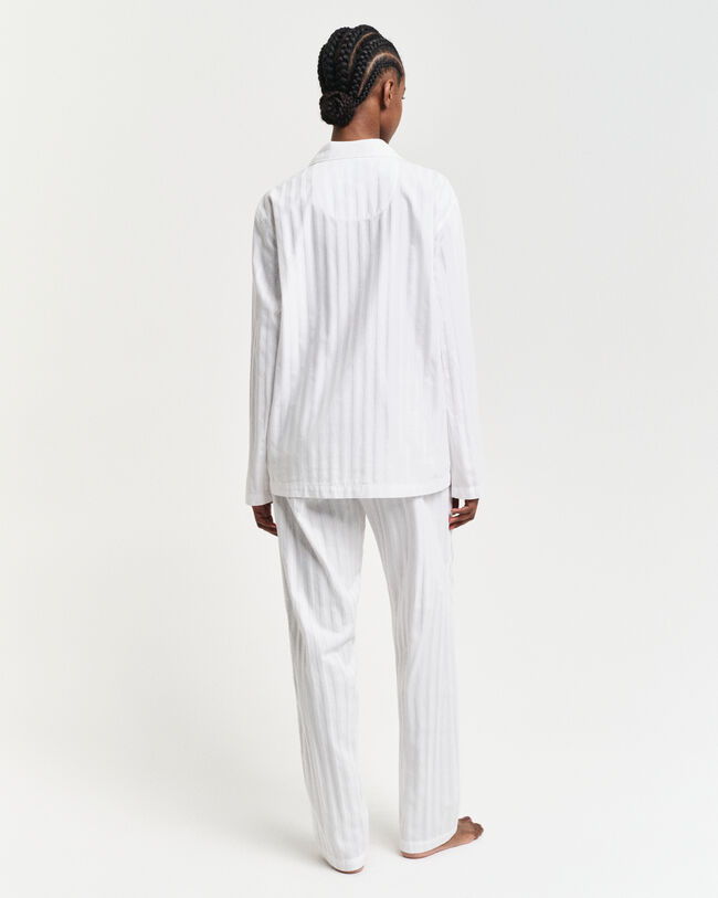 Raidallinen pyjama lahjapakkauksessa