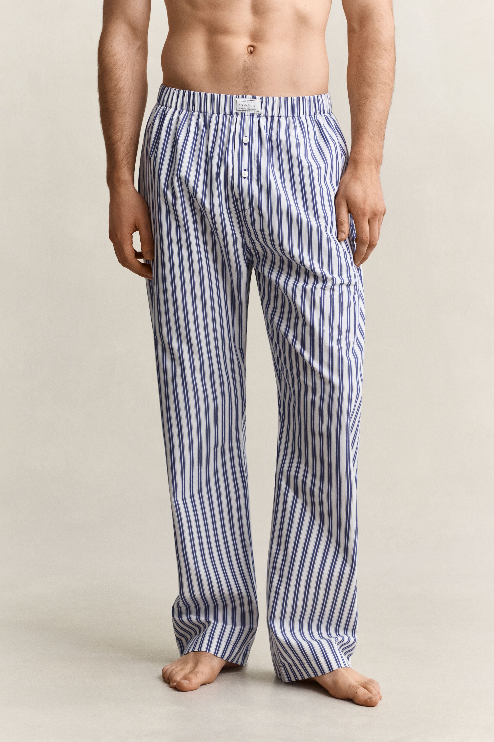 Raidalliset pyjamahousut