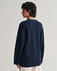 Relaxed fit ‑mitoitettu neuletakki, jossa v-pääntie