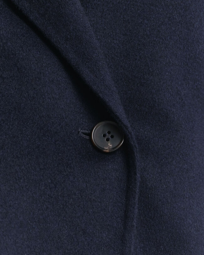 Käsin tikattu takki ja vyö