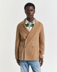 Käsin tikattu klubitakki