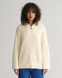 Kalanruotokuvioinen neulepusero, jossa vetoketjullinen pääntie