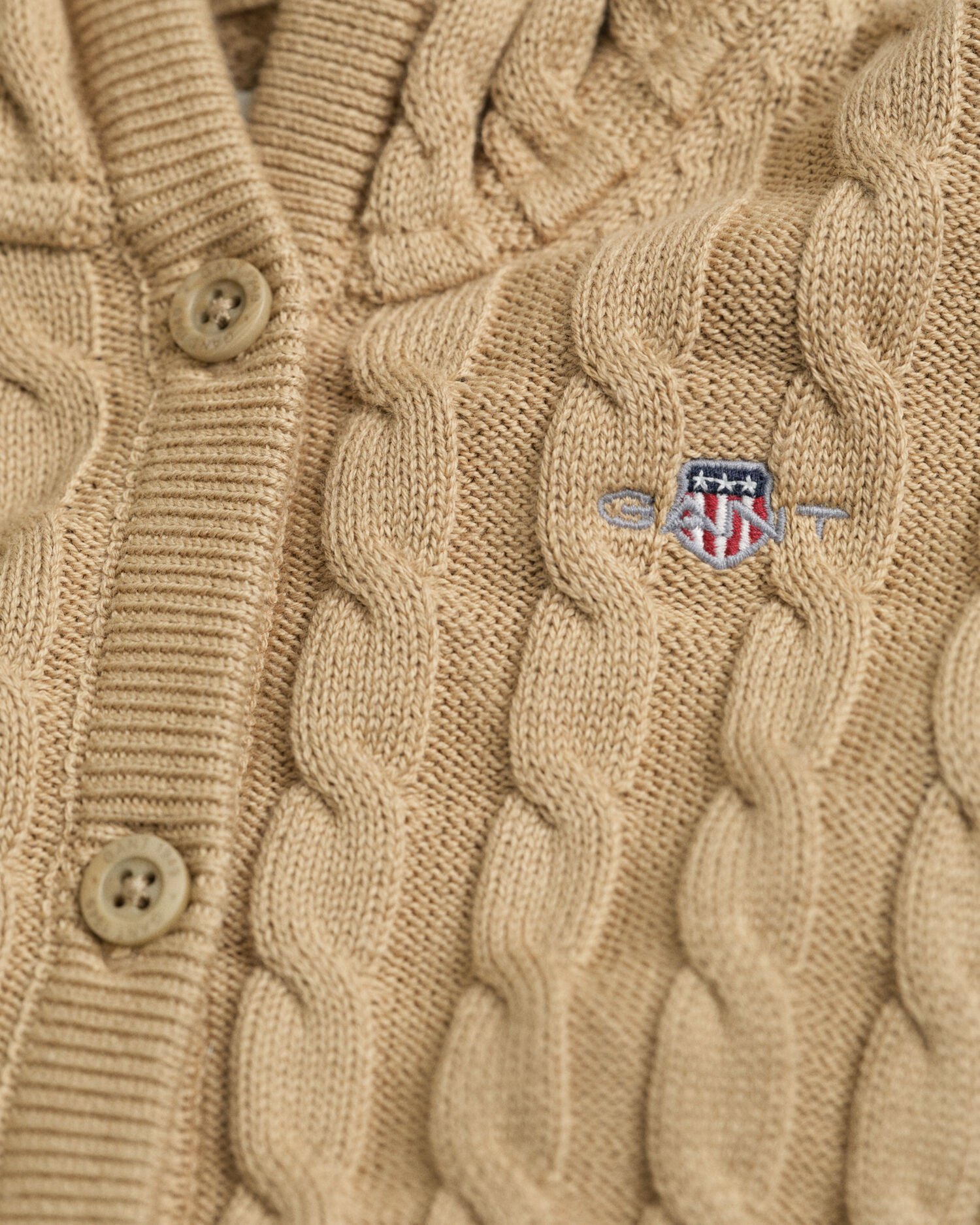 Baby-malliston puuvillainen palmikkoneuletakki