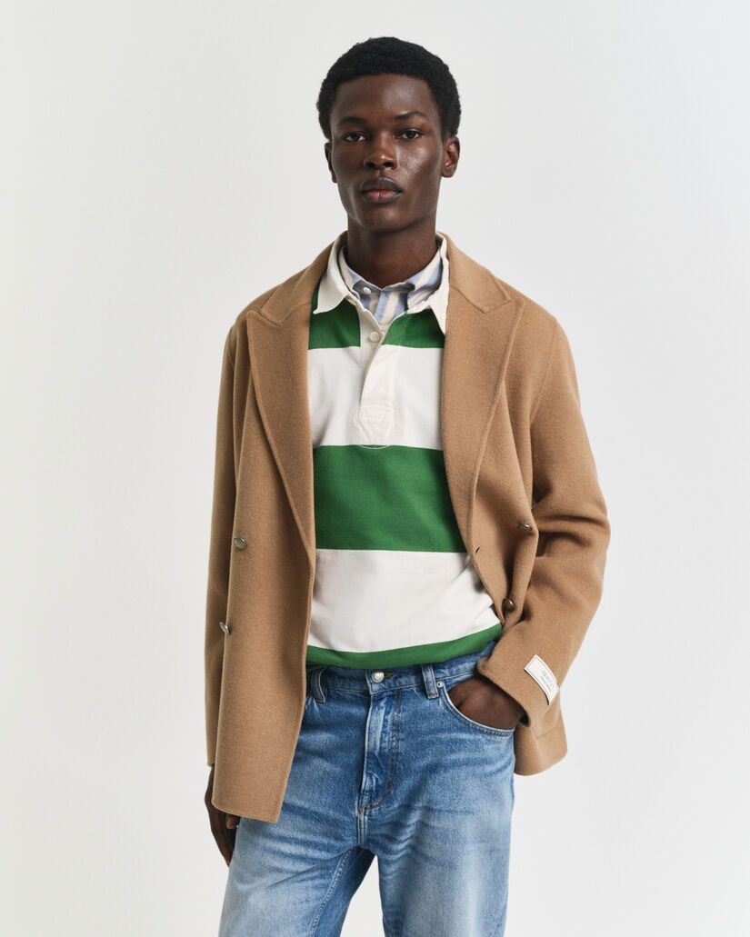 Käsin tikattu klubitakki