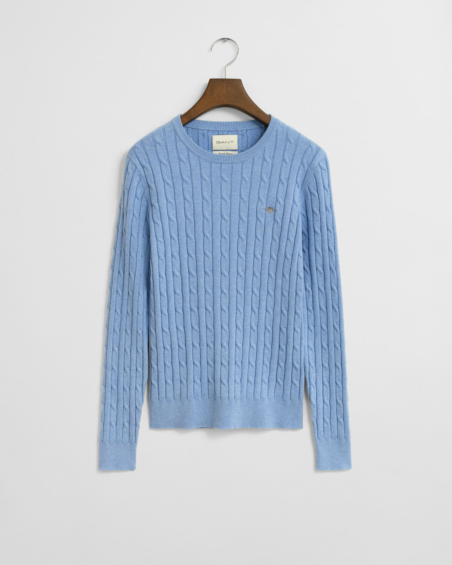 Joustopuuvillainen palmikkoneulepusero, jossa pyöreä pääntie