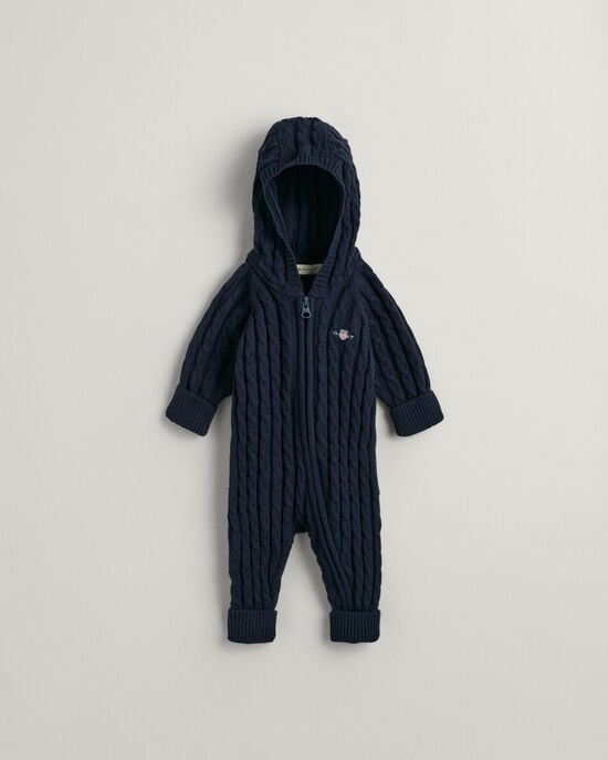 Baby-malliston puuvillainen Shield-palmikkoneulehaalari