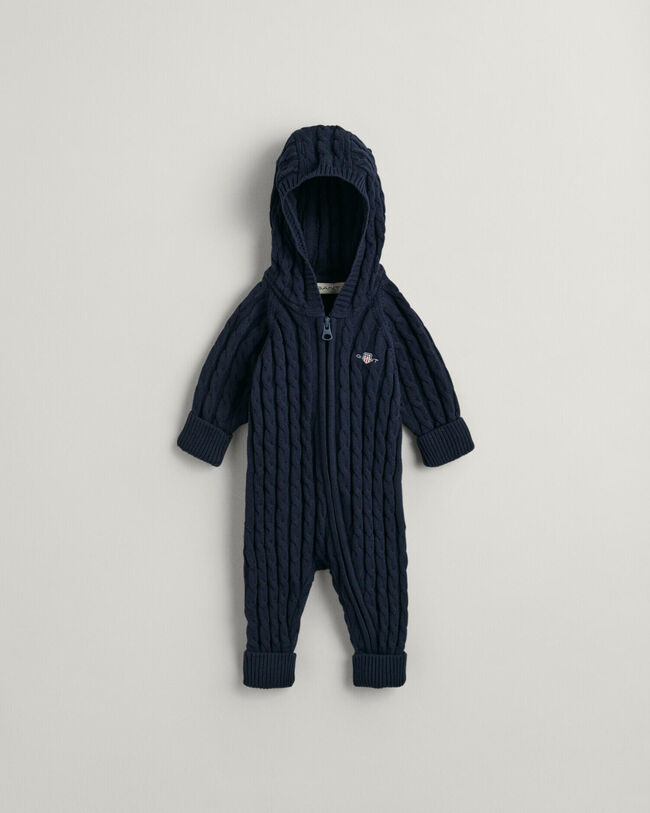 Baby-malliston puuvillainen Shield-palmikkoneulehaalari