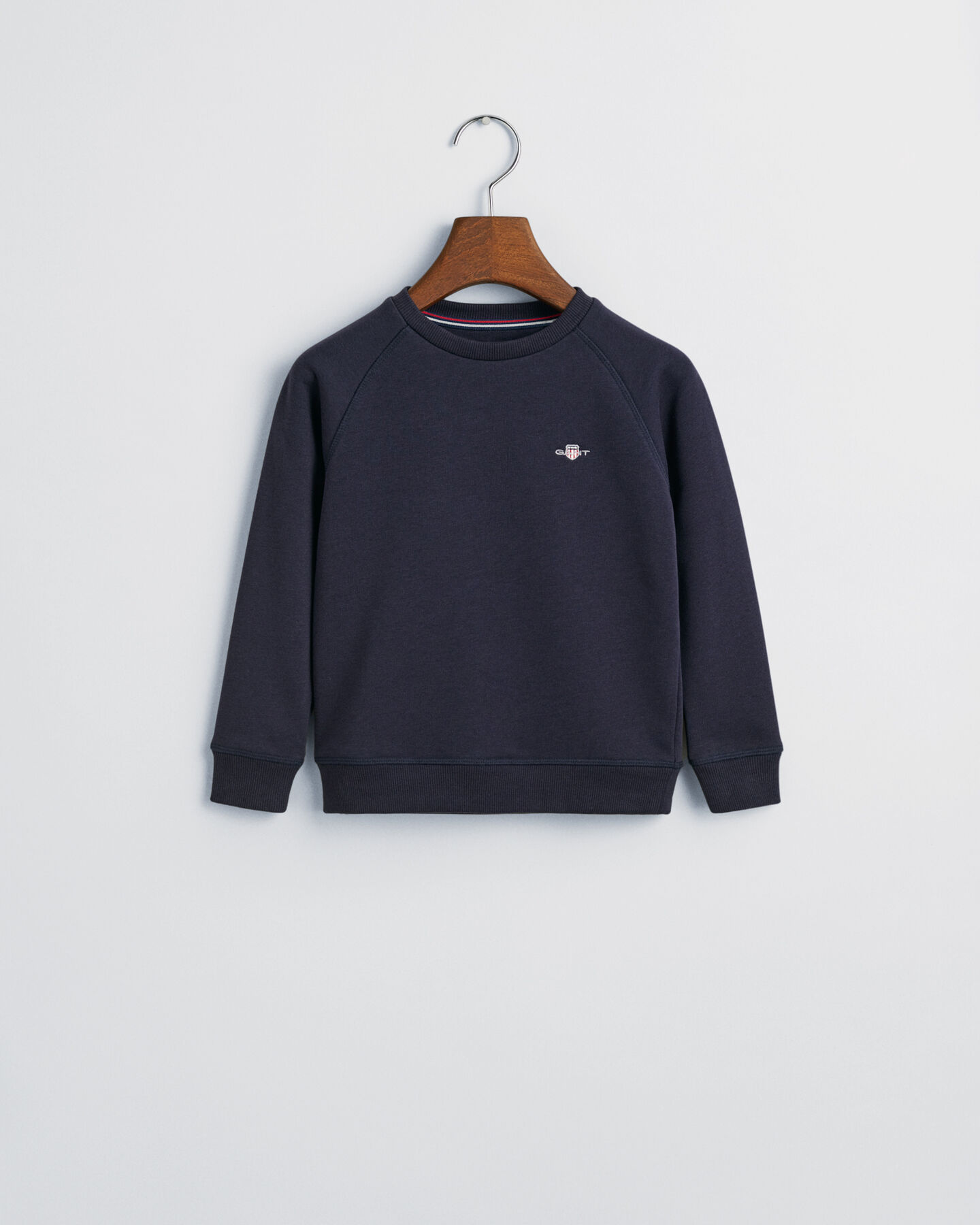 Kids-malliston Shield-collegepaita, jossa pyöreä pääntie