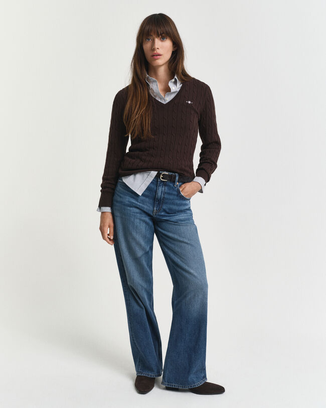 Joustava puuvillapalmikkoneule, jossa v‑pääntie