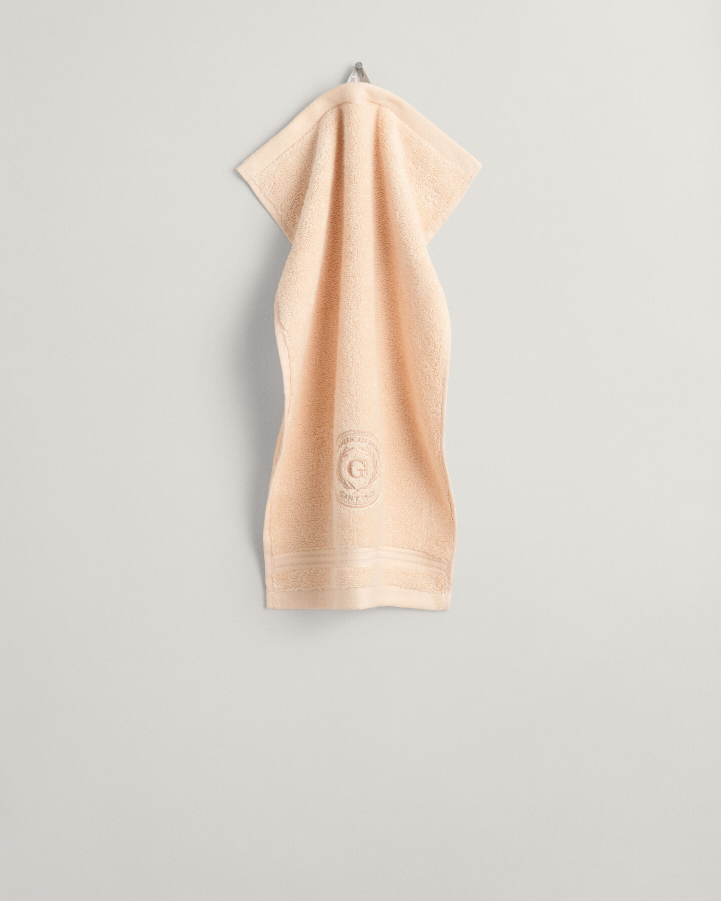 Crest‑pyyhe (30 cm x 50 cm)