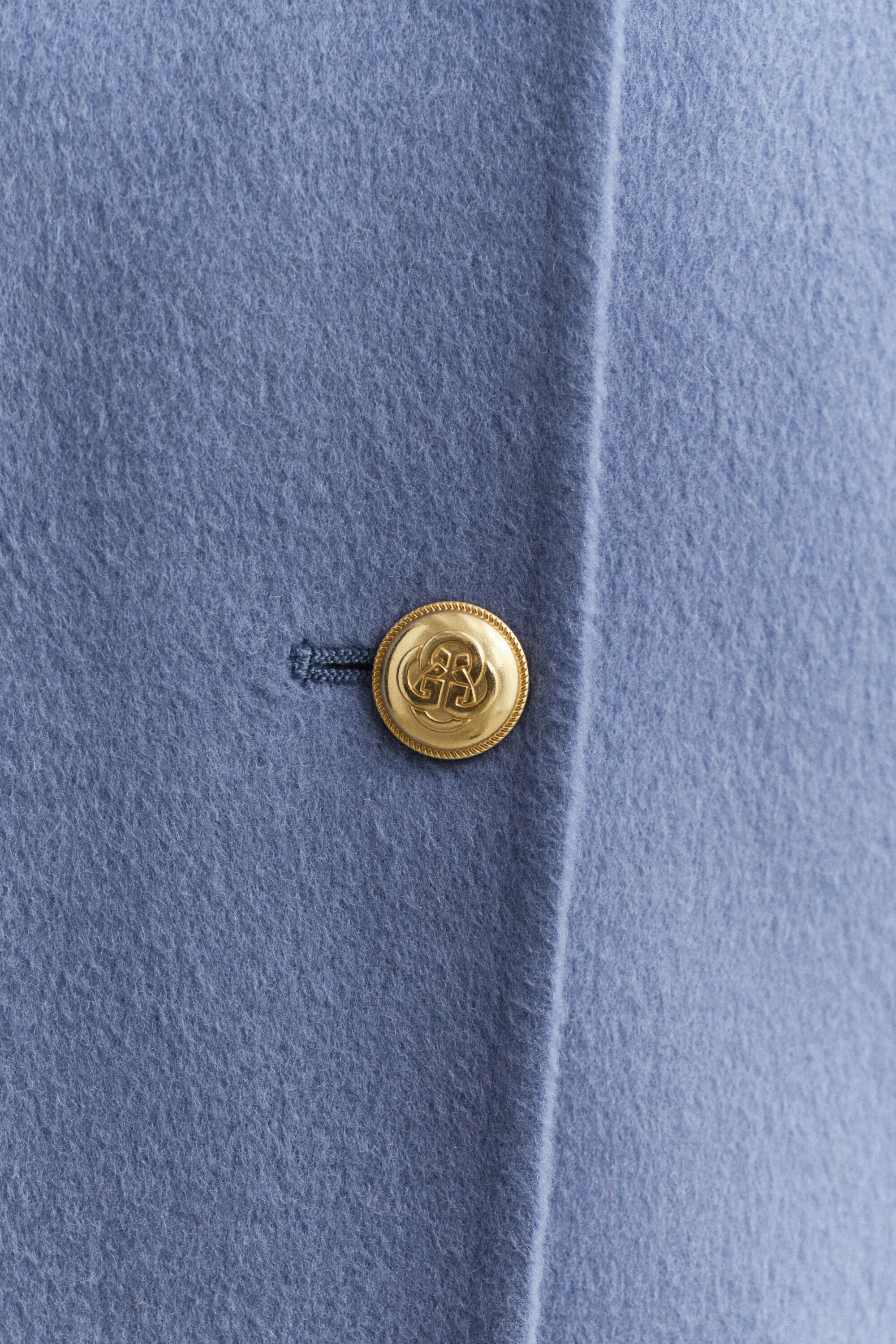 Käsin tikattu kansitakki