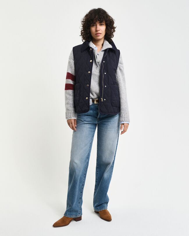 Vakosamettisomisteinen tikkiliivi