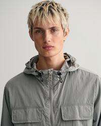 Nelitaskuinen hupputakki