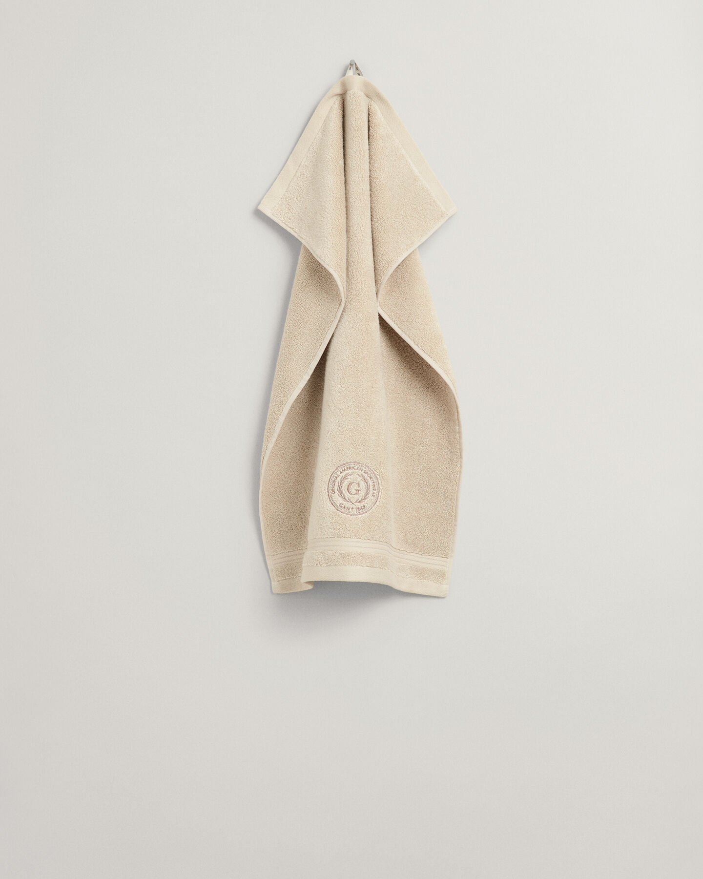 Crest‑pyyhe (30 cm x 50 cm)