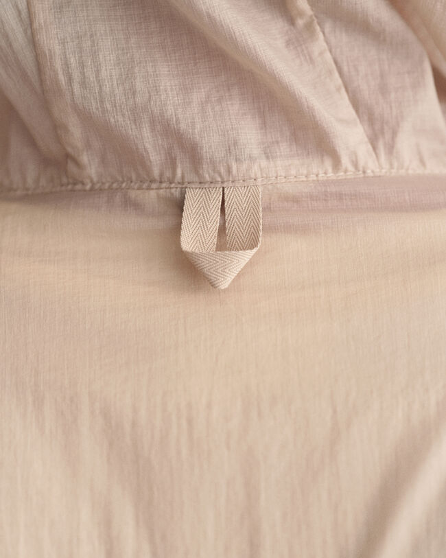 Taskuun pakattava kevyt Windbreaker-takki